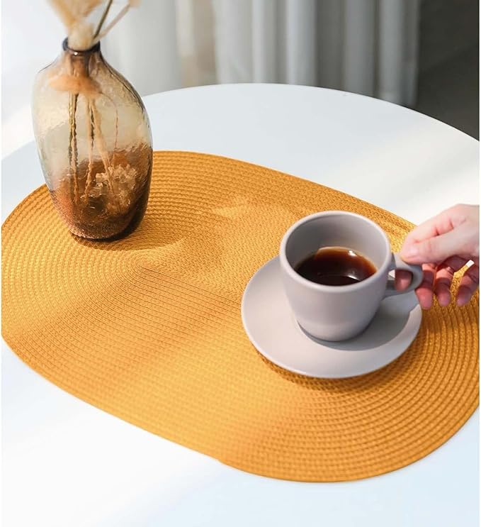 FunWheat Oval Braided Placemats Set of 4 Table Mats for Dining Tables Washable Heat Resistant Place Mats for Indoor Outdoor Use 12 x18 Inch(Oval Pumpkin Yellow, 4pcs)